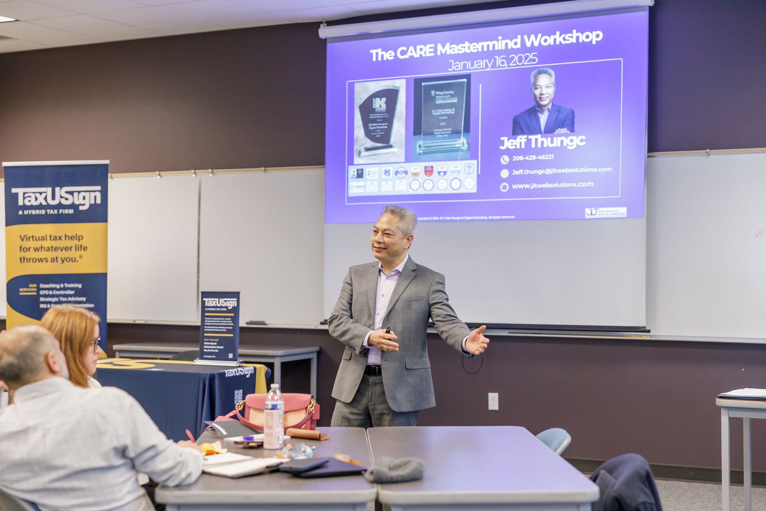 tax USign workshop in Kent, WA for business owners man presenting in front of group in conference room