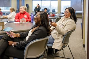 tax USign workshop in Kent, WA for business owners attendees smiling laughing at learning presentation