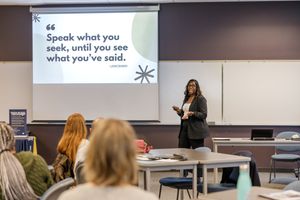 tax USign workshop in Kent, WA for business owners woman presenting in front of group in conference room