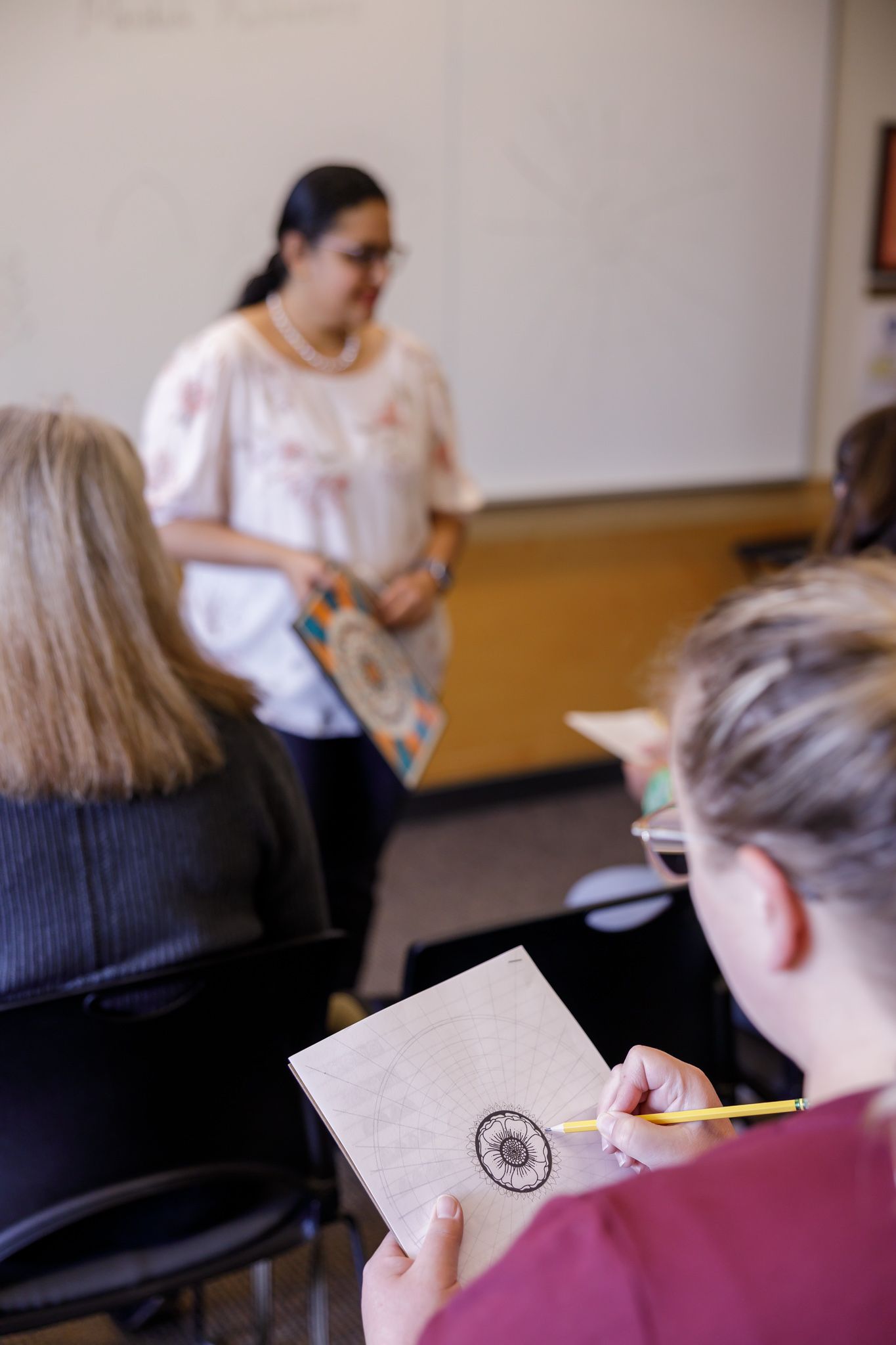 woman teaching drawing art class in mercer island for Eastside women's day out wellness event