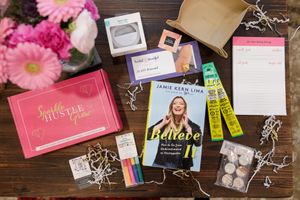 woman productivity business coach for business owners planning workshop swag gift box of Sparkle Hustle Grow with book, snacks, pens