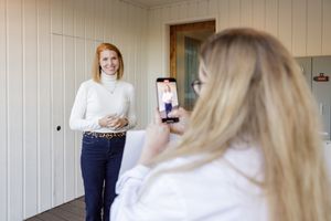 woman productivity business coach for business owners planning workshop woman being recorded on phone for social media client testimonial