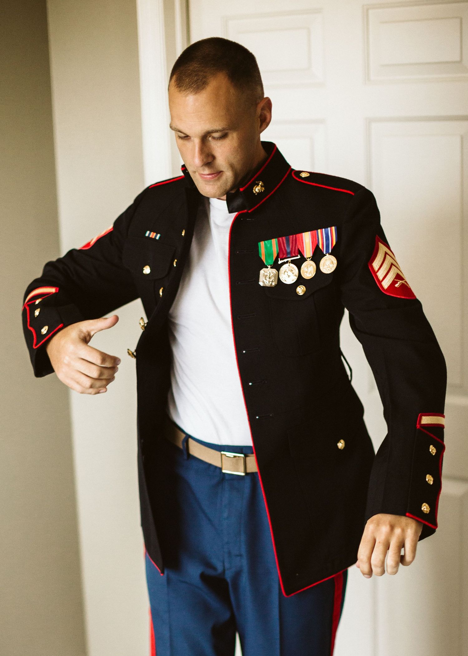 Marine dress uniform with medals and decorations displayed in detail shots.