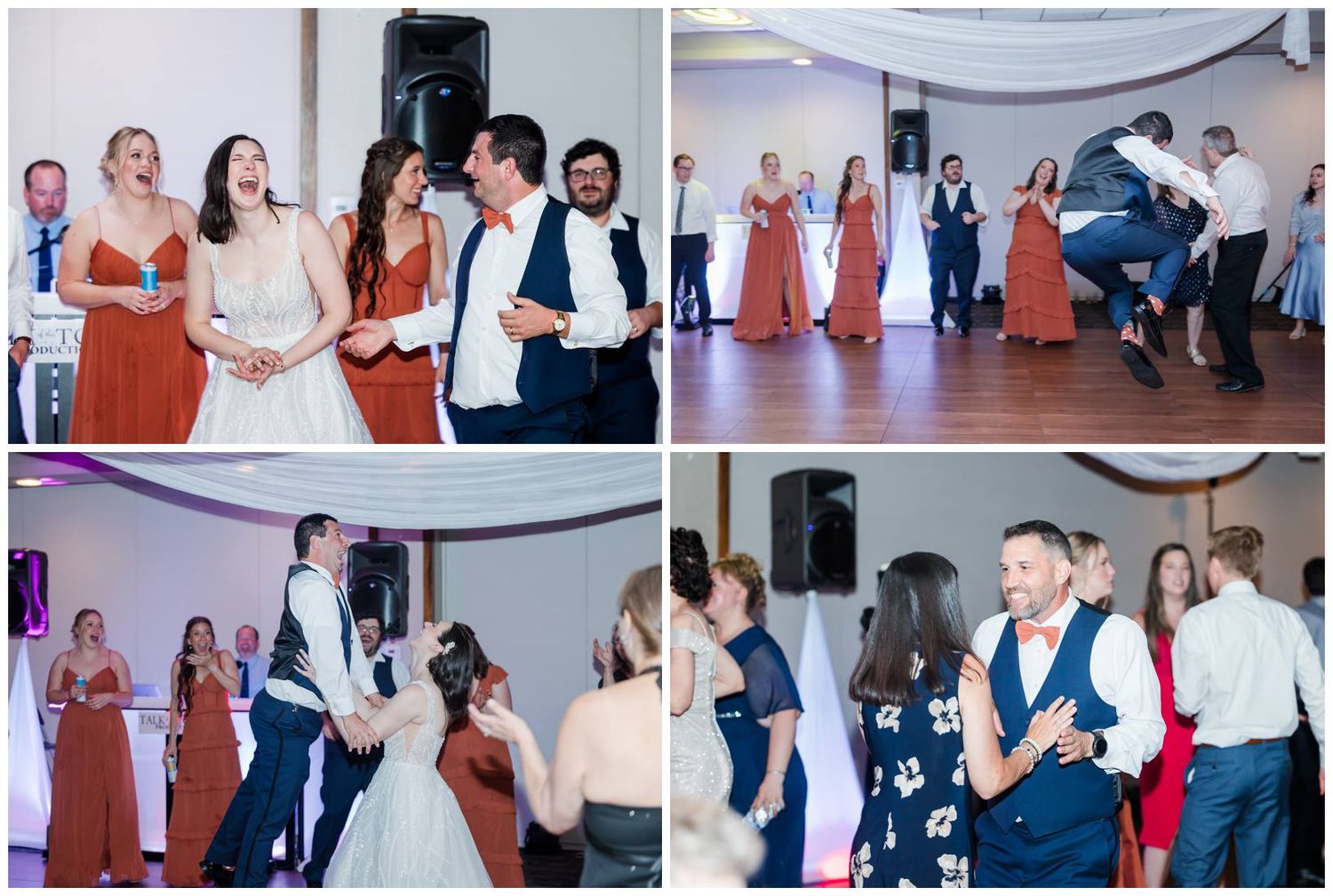 Wedding guests laugh and dance together at a lively reception celebration in an elegant venue.