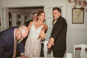Candid moment of wedding celebration with guests inside venue.