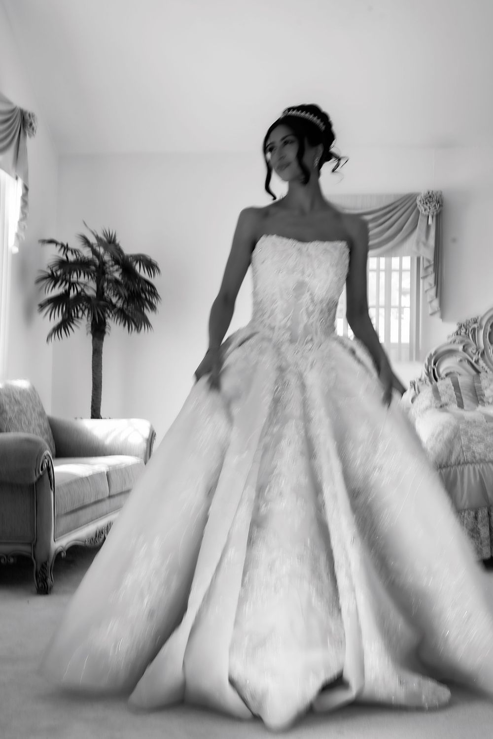 A series of artistic black and white photos showing a flowing white wedding gown with dramatic full skirt.