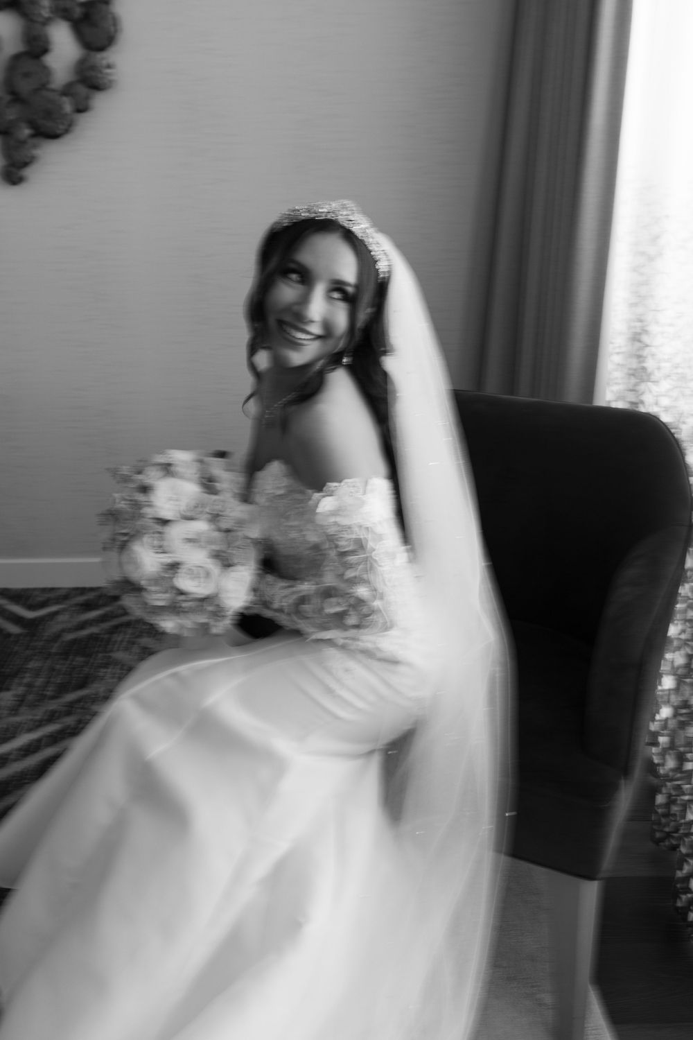 A series of black and white photos showing a bride in a flowing white gown seated in an elegant chair.