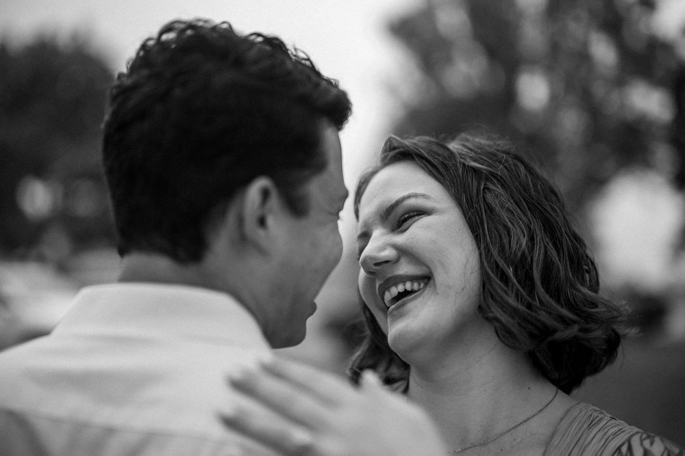 A romantic black and white photo series showing intimate moments between two people in love across multiple frames.
