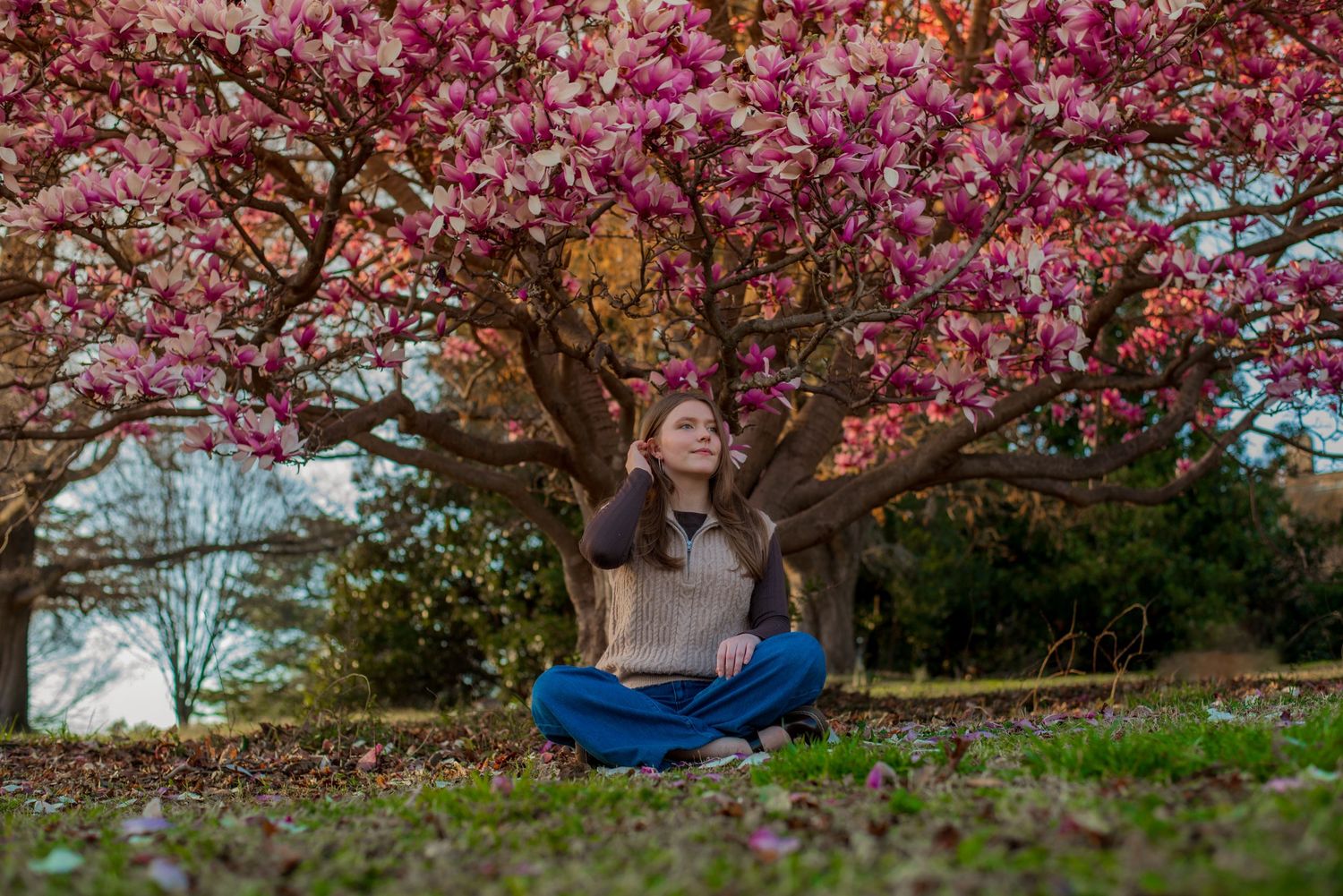 Photography of young woman with pink blooming tree