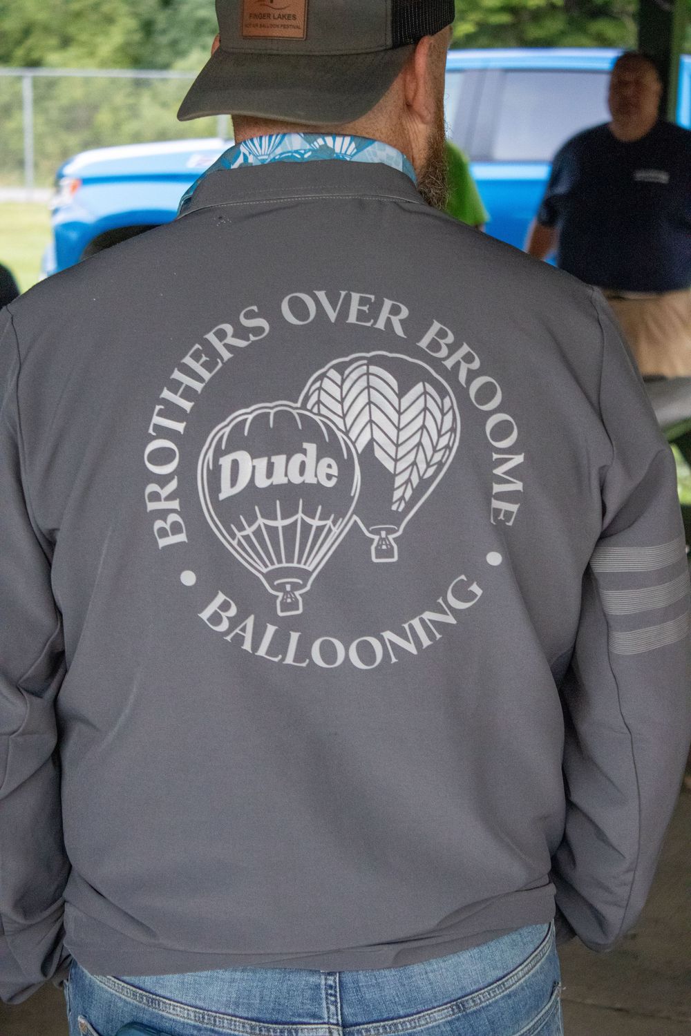 Gray jacket with hot air balloon logo and text 'Brothers Over Balloons' design shown from behind.