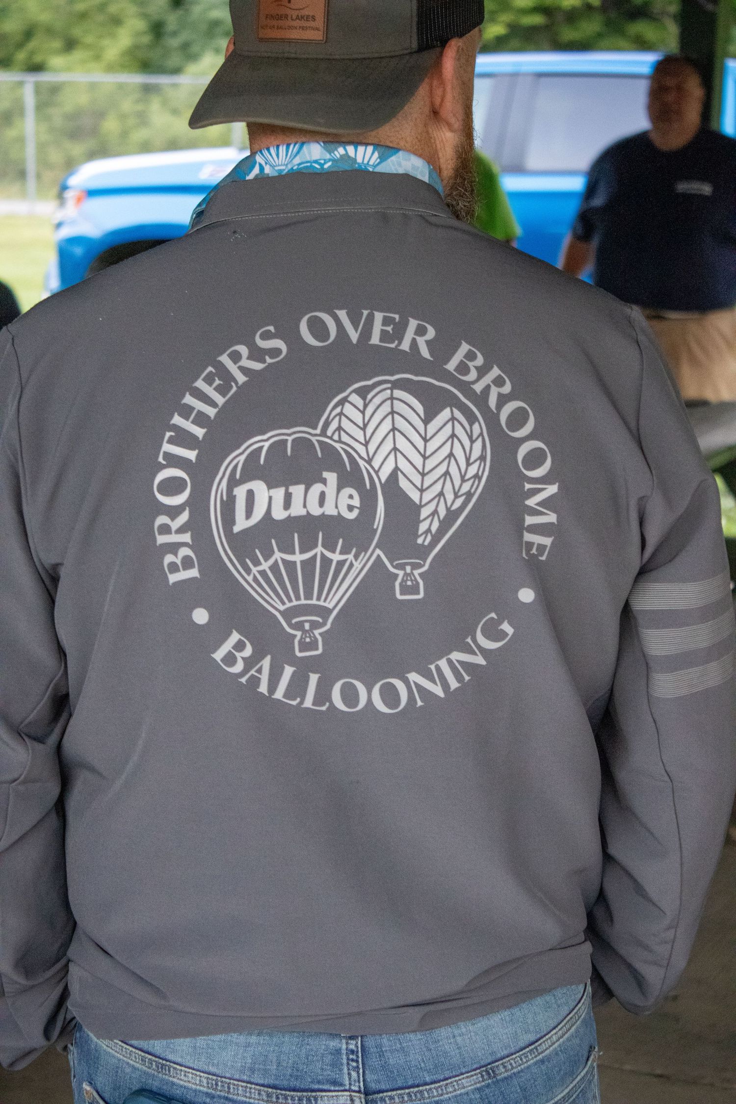 Gray jacket with hot air balloon logo and text 'Brothers Over Balloons' design shown from behind.