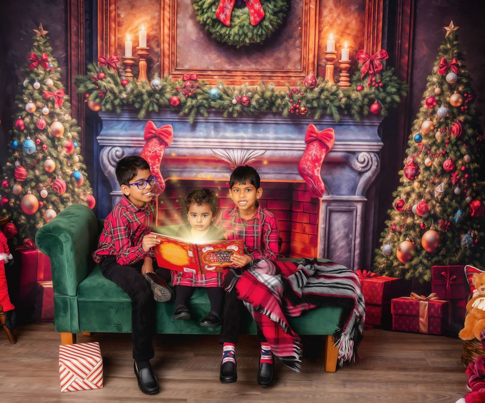 Cozy Christmas scene with decorated trees, stockings and green velvet couch by a fireplace with glowing storybook.