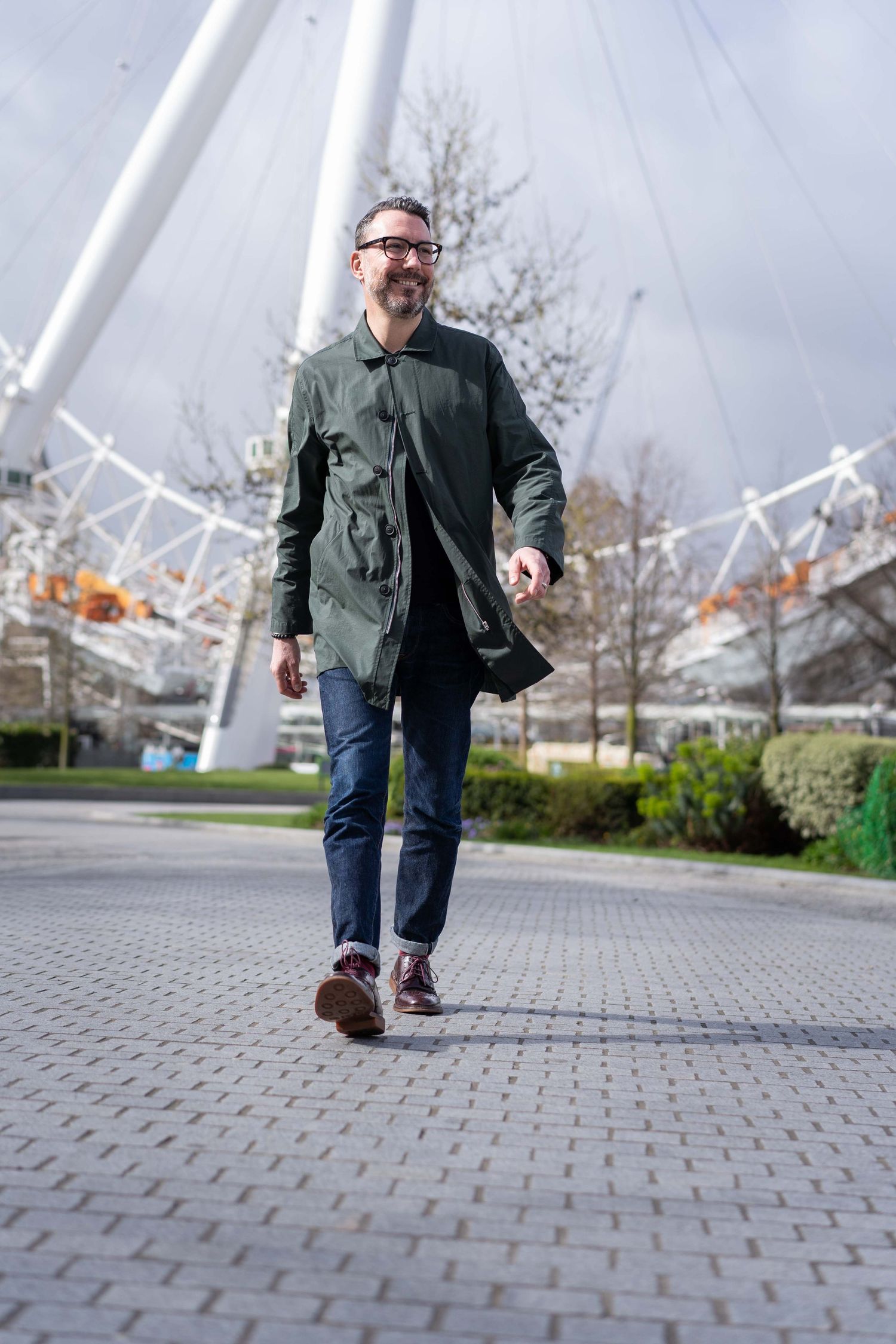 A London entrepreneur walking in Southbank, London during a personal branding photography session.