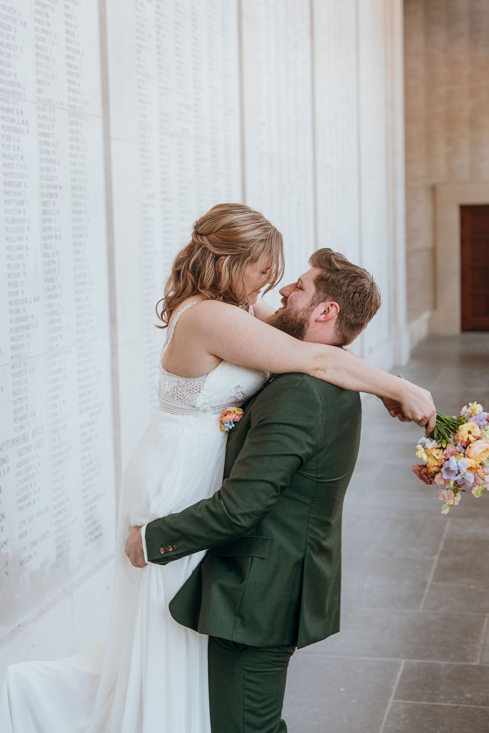 Series of romantic wedding photos showing a couple sharing their first kiss at their wedding ceremony.