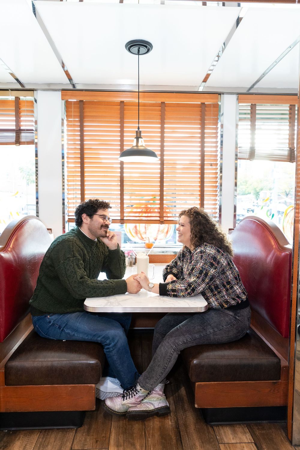 Engaged Couple enjoys milkshake at Bel-Aire Diner in Astoria, Queens.
