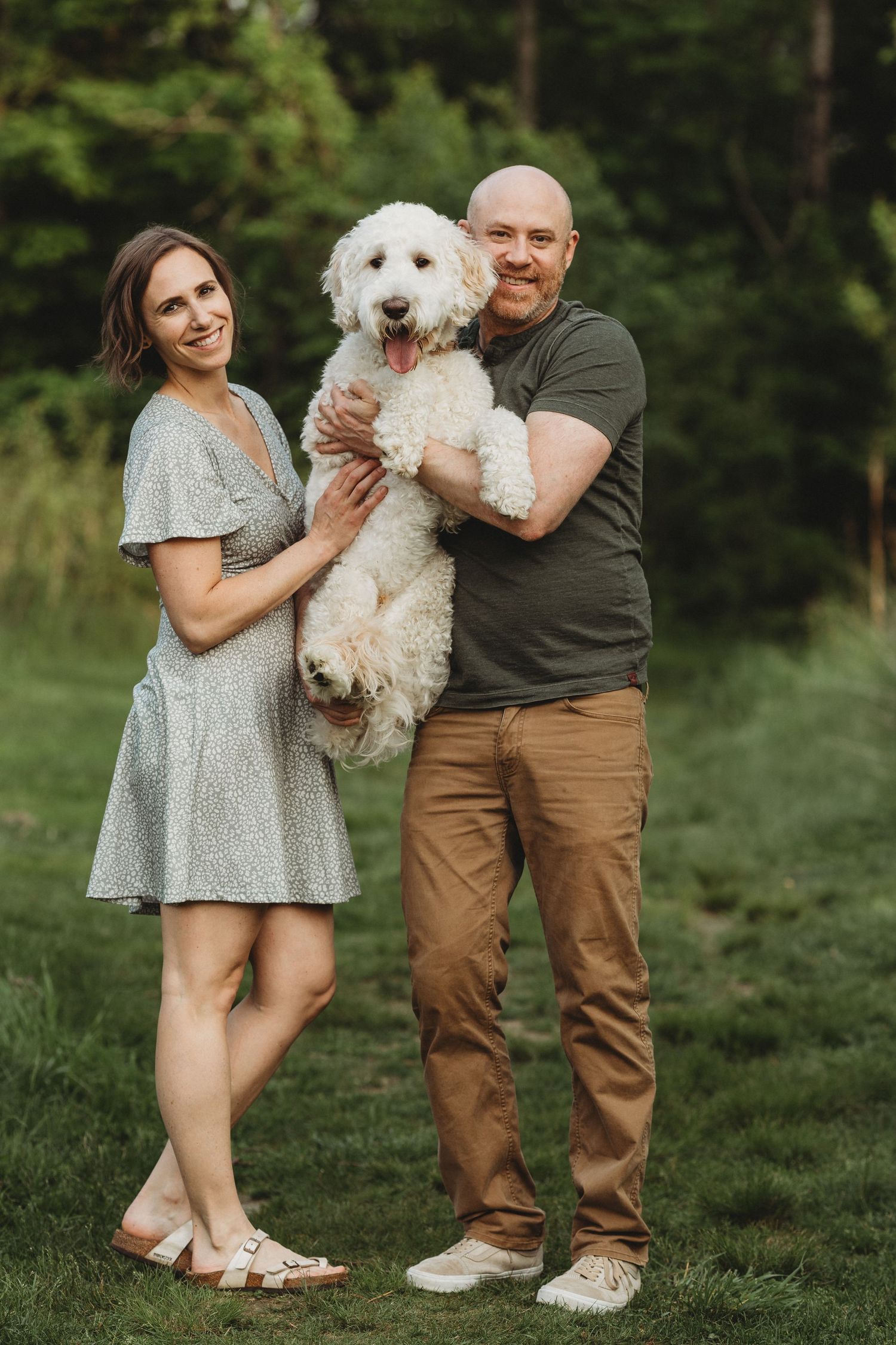 Professional photo of a dog wtih his family