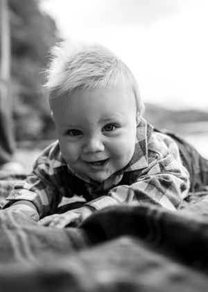 Black and white portrait of a toddler smiling classic family photography child portrait