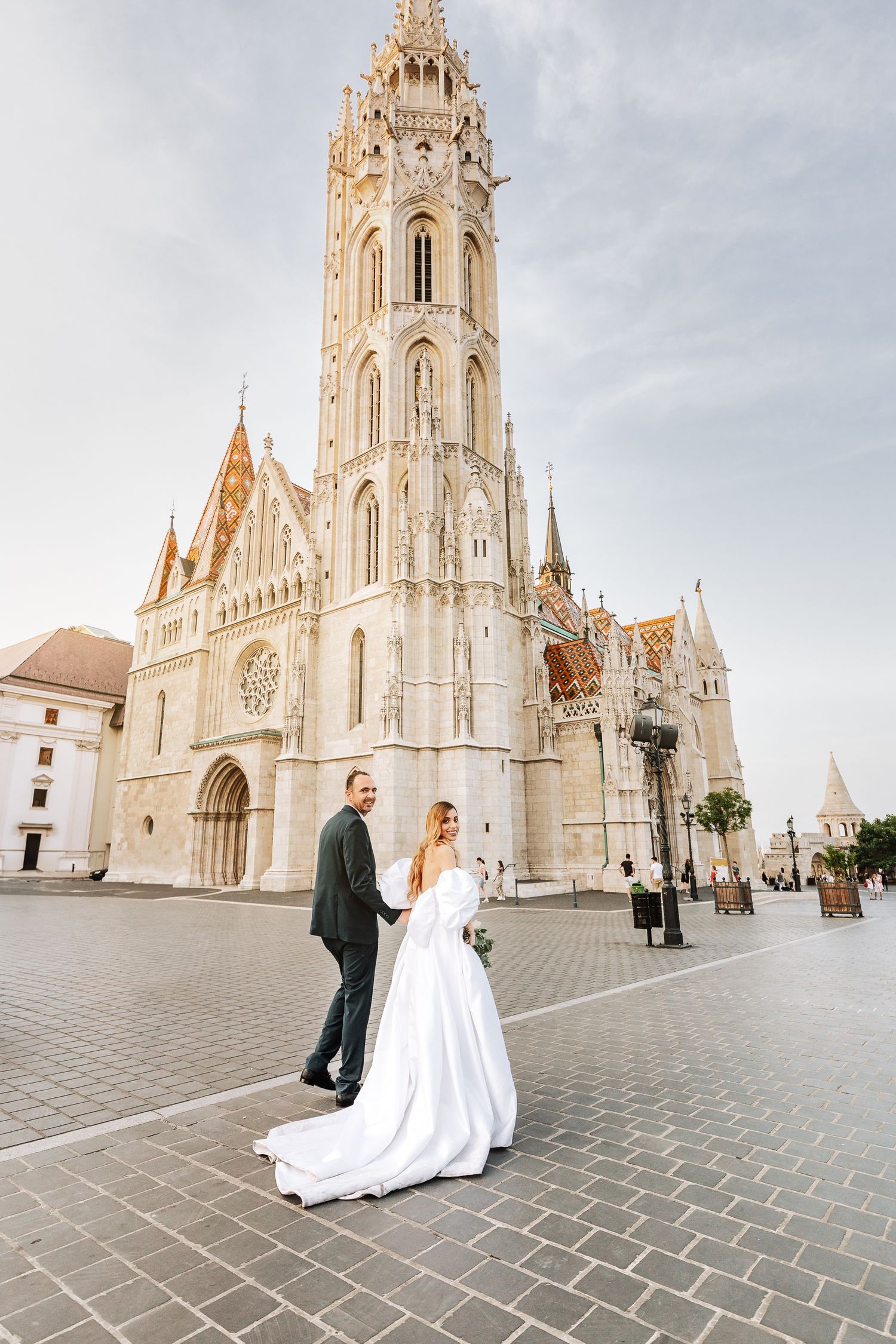 A joyful outdoor wedding celebration captured in a series of black and white moments on a beautiful sunny day.