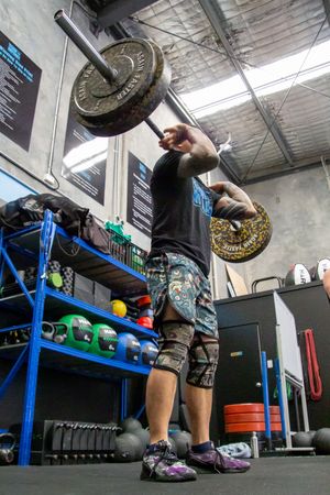 Series of action shots showing kettlebell swing exercises in a gym setting.