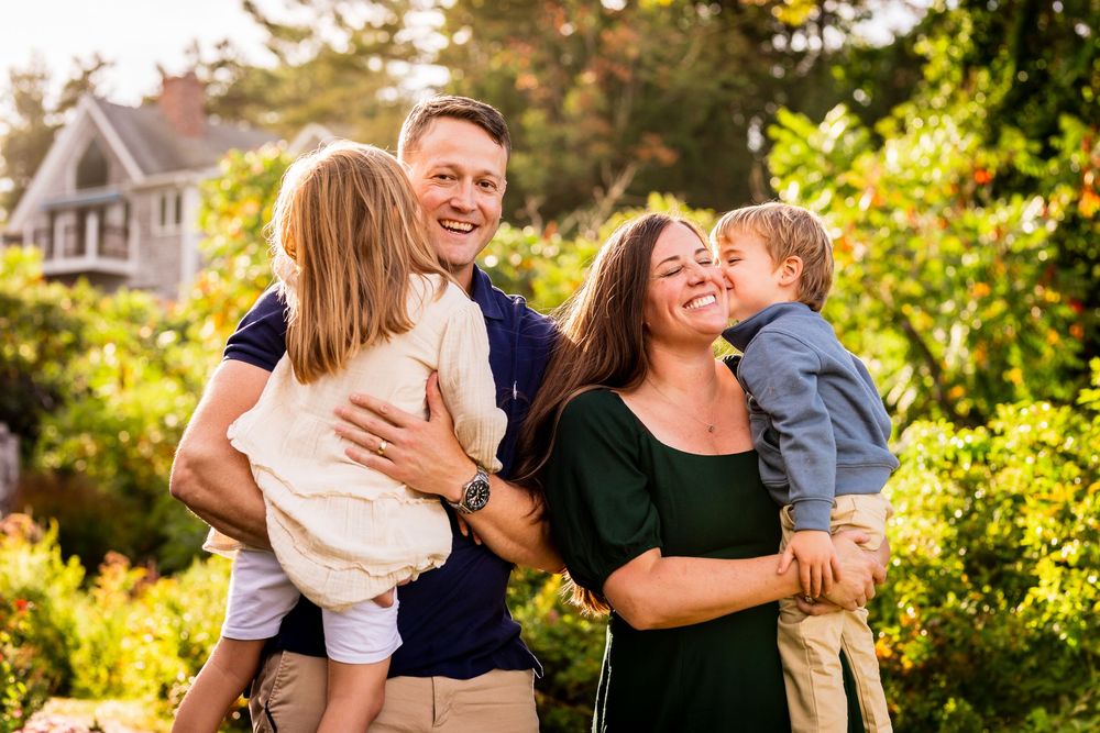 Family moments captured in warm sunset light with joyful interactions outdoors.