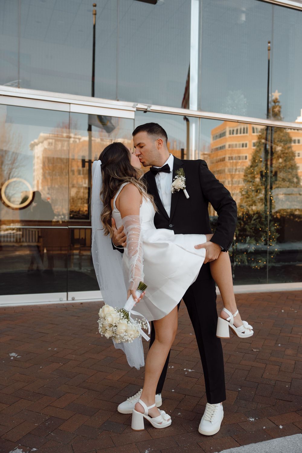 A romantic outdoor wedding photoshoot sequence on brick pavement with bride in white dress and groom in black suit.