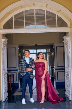 a couple standing in a door way
