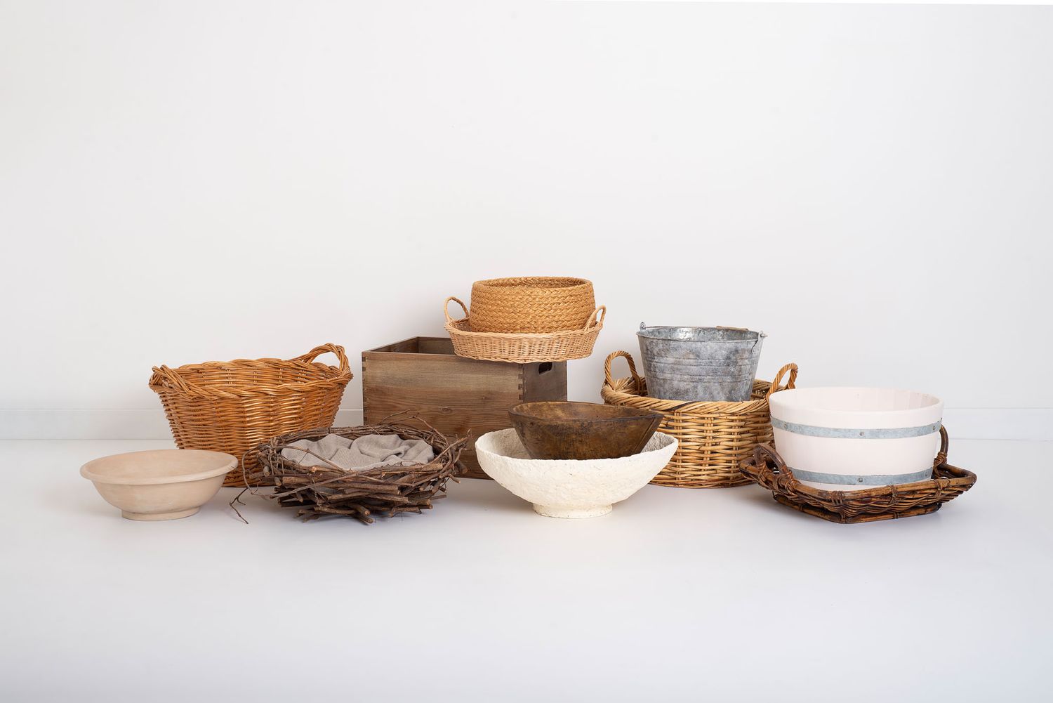 newborn, sitter and cake smash prop collection in natural materials and tones like baskets, wooden and bowls
