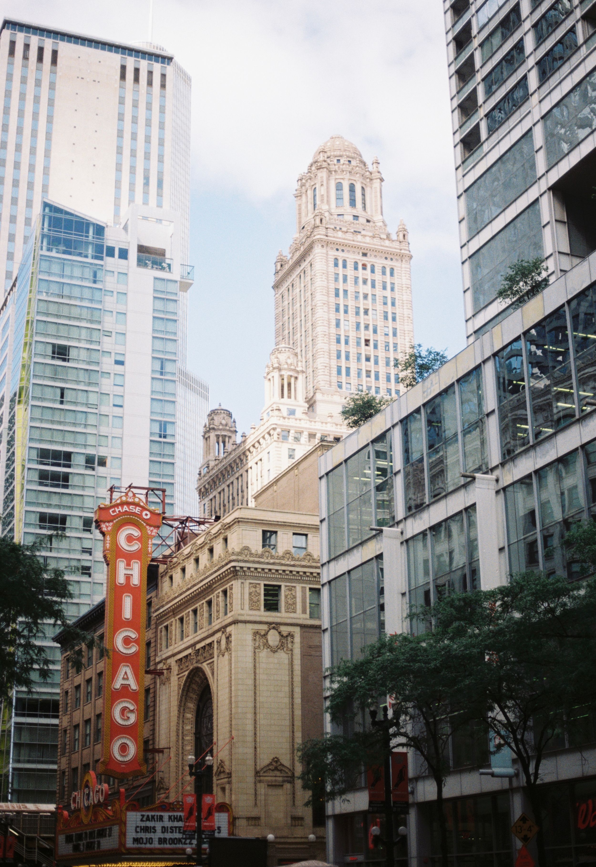 Historic Chicago Theatre building with ornate architecture and vertical marquee sign viewed from different angles on city street.