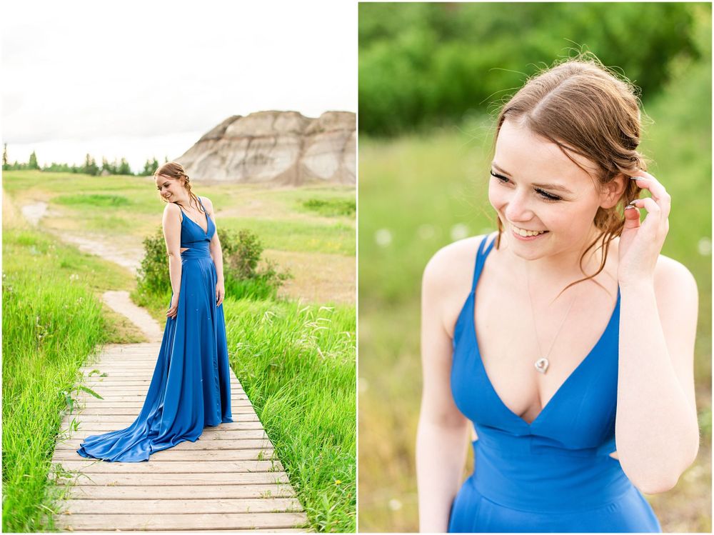 Elegant blue gown captured against natural rock formations and green prairie landscape.