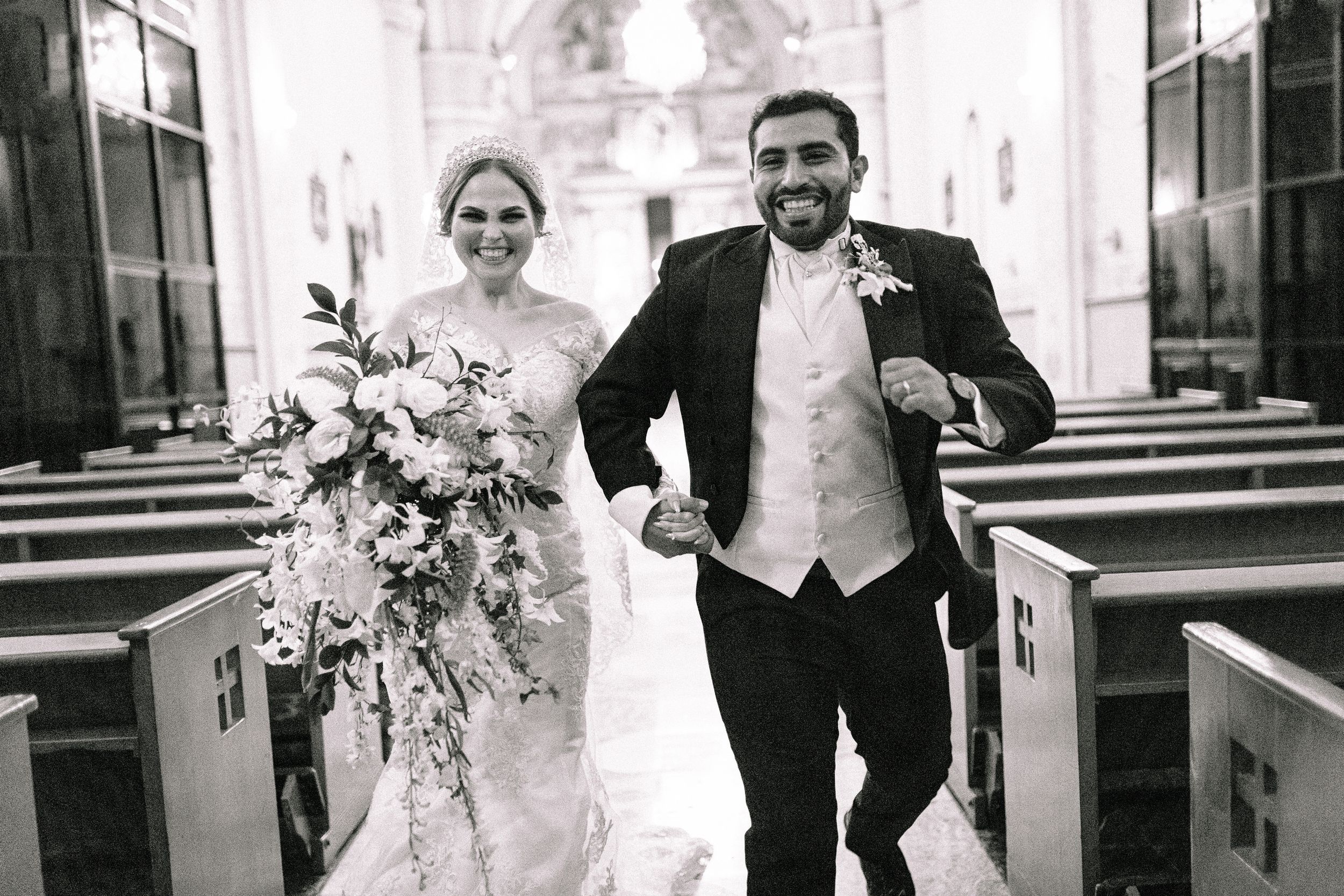 Modern wedding portraits captured in an elegant architectural setting with clean lines and natural light.