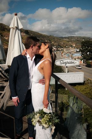 Wedding photos taken at Surfside location with coastal scenery and blue skies.