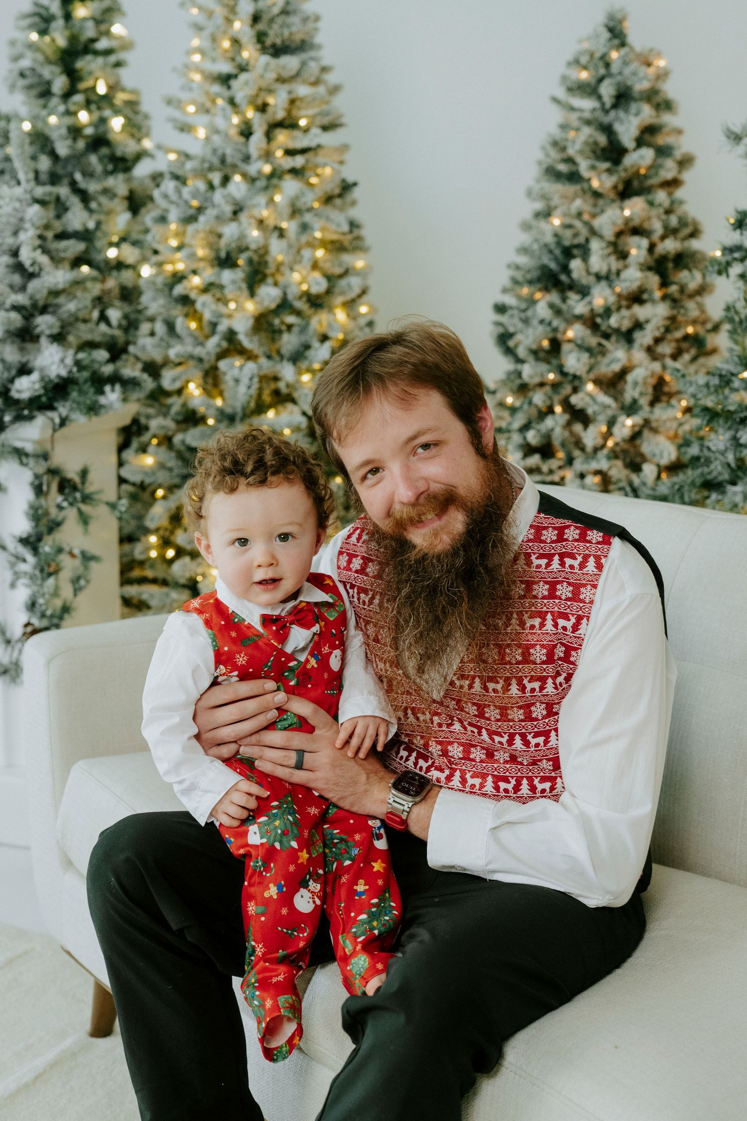 A festive holiday photo sequence showing a sweet moment on a white couch with Christmas trees in the background.
