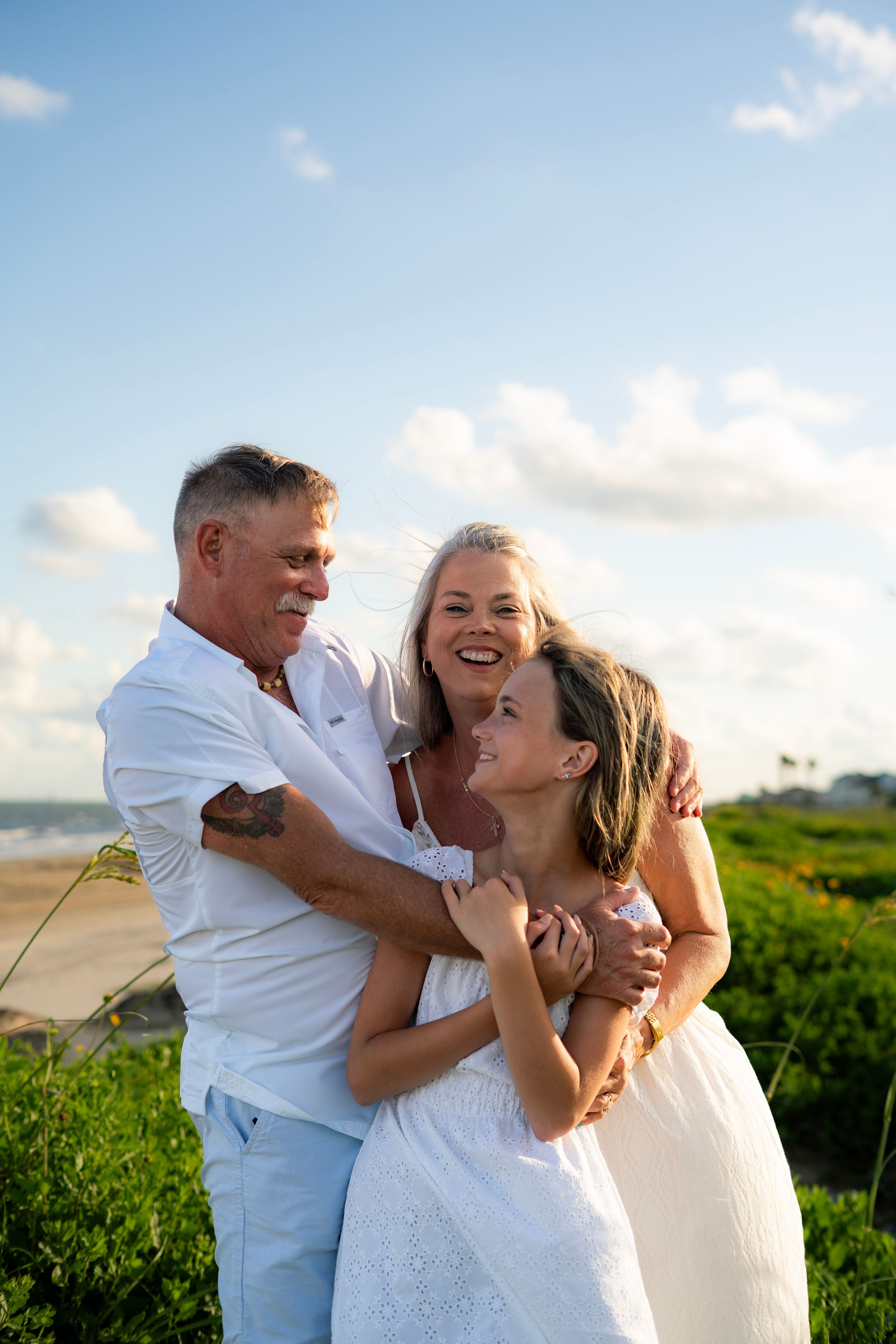 Family session on the beach at Galveston, TX. Natural light, candid moments, lifestyle photography, kid photography, couple photography,