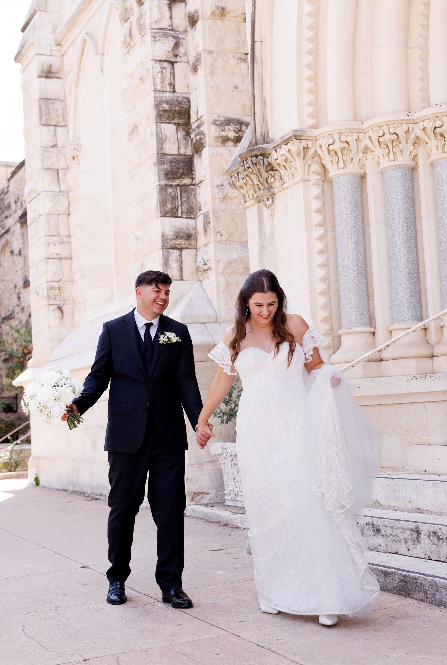 A series of wedding photos showing a couple walking along a stone church exterior with elegant columns.