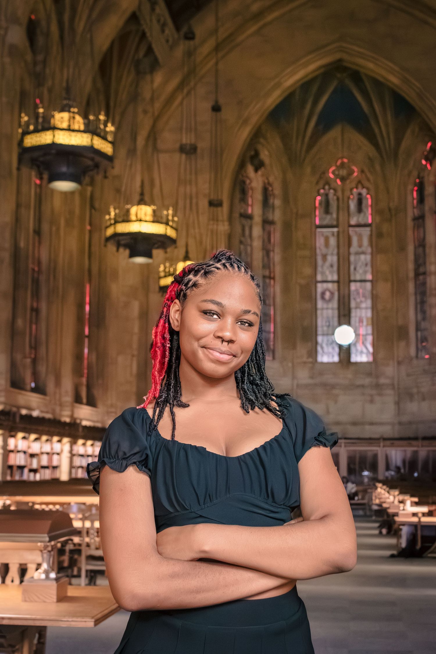 Senior portrait at the University of Washington Suzzallo Library reading room.