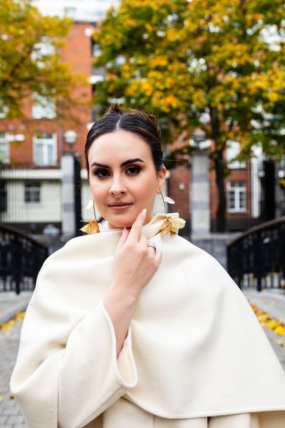 Refined portrait with statement earrings — modern, elegant post-wedding style.