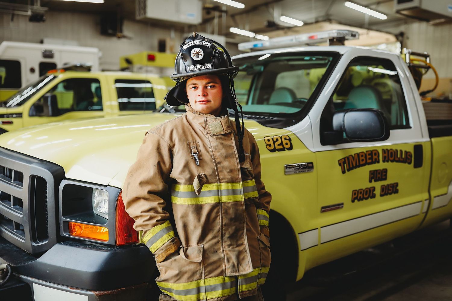 Firefighter in full gear standing in front of yellow emergency response vehicle.

Best photographer in Illinois