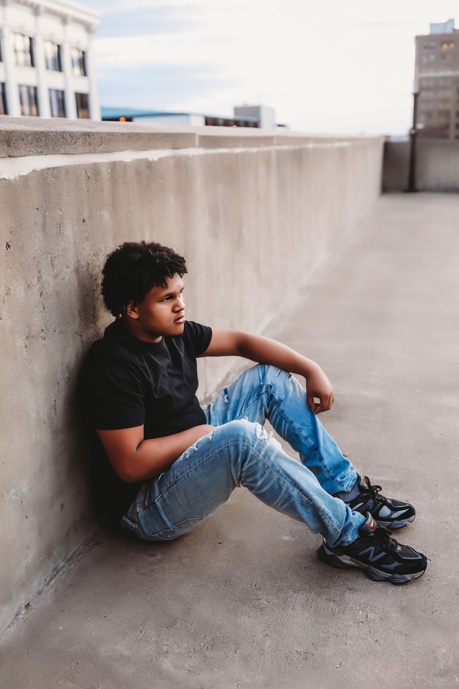 Artistic urban portrait showing person reclining against concrete wall.
Best photographer in Illinois