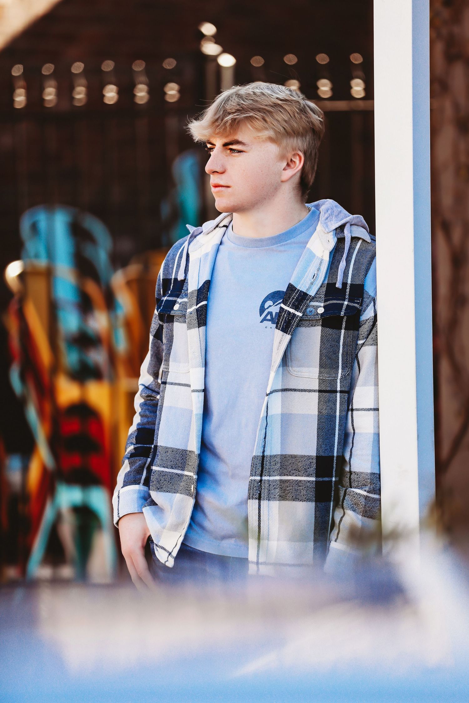 Casual portrait of someone wearing a plaid flannel and blue t-shirt against a blurred background.
Best photographer in Illinois