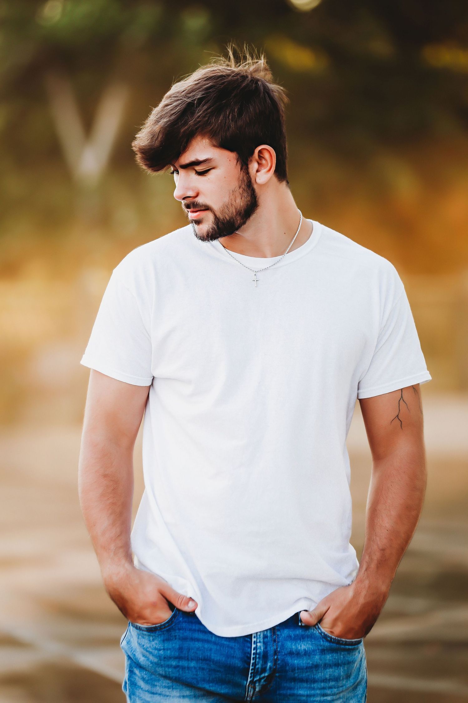 Portrait of someone in white t-shirt and jeans against blurred nature background at sunset.
Best photographer in Illinois