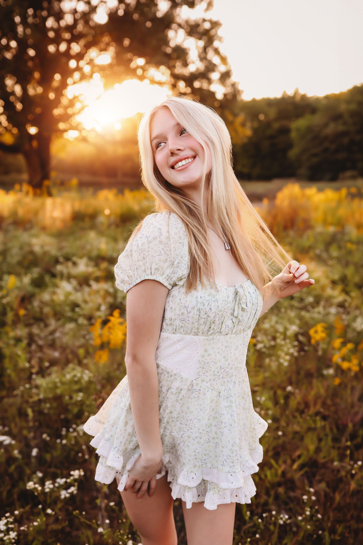Person in white lace dress twirls in wildflower field during golden hour.
Best photographer in Illinois