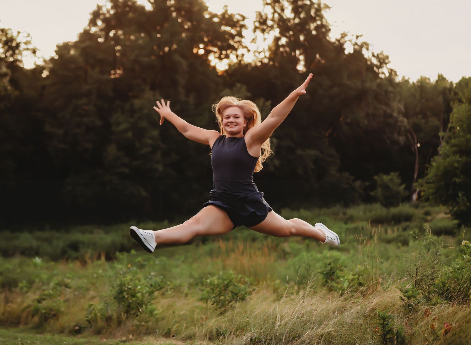 Dynamic jumping pose captured in golden field at sunset.
Best childs photographer in Illinois