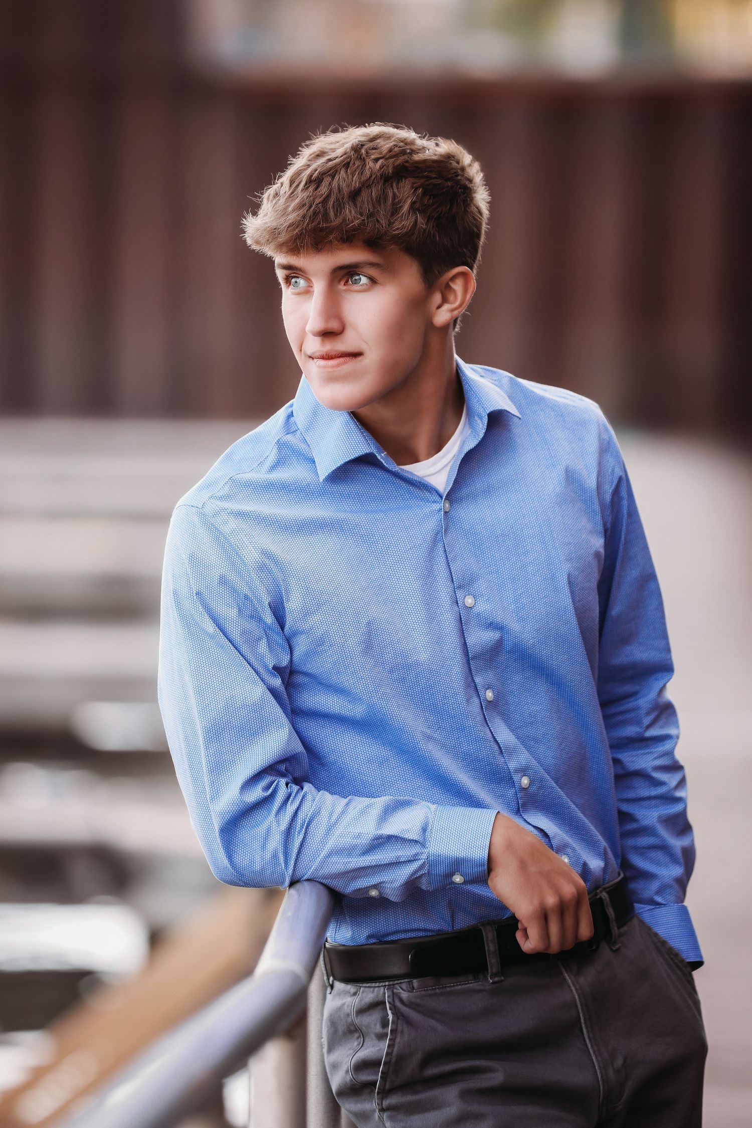 Portrait series showing subject in light blue button-down shirt against brown background.
Best teens photographer in Illinois