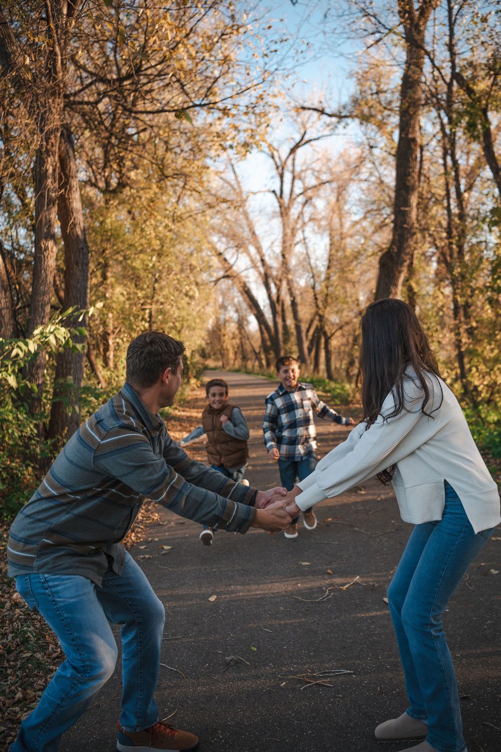 A fun sequence showing playful interaction on a wooded path during autumn.