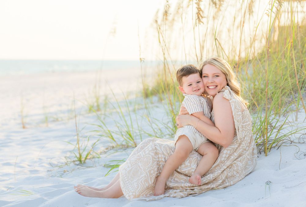 Series of romantic beach photos showing couple embracing on white sand dunes at sunset.