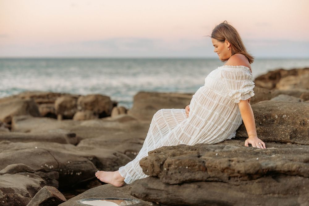Maternity photography session at Point Cartwright beach on the Sunshine Coast.