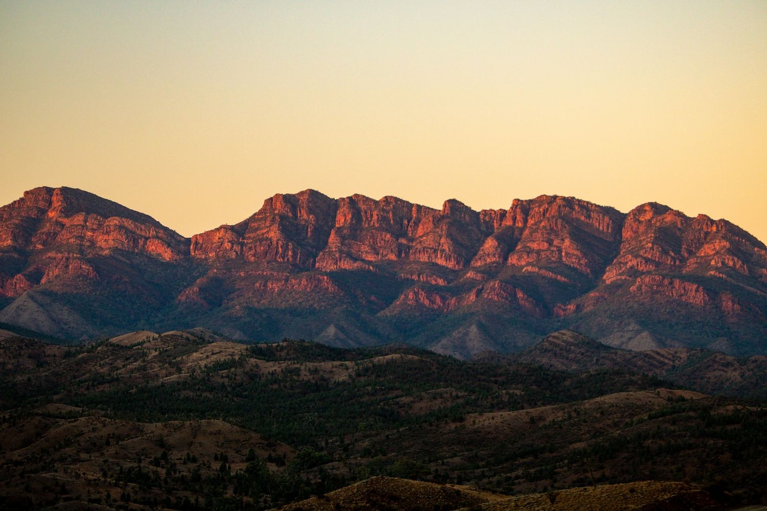 Red rocky mountains glowing at sunset in the Flinders Ranges, South Australia.