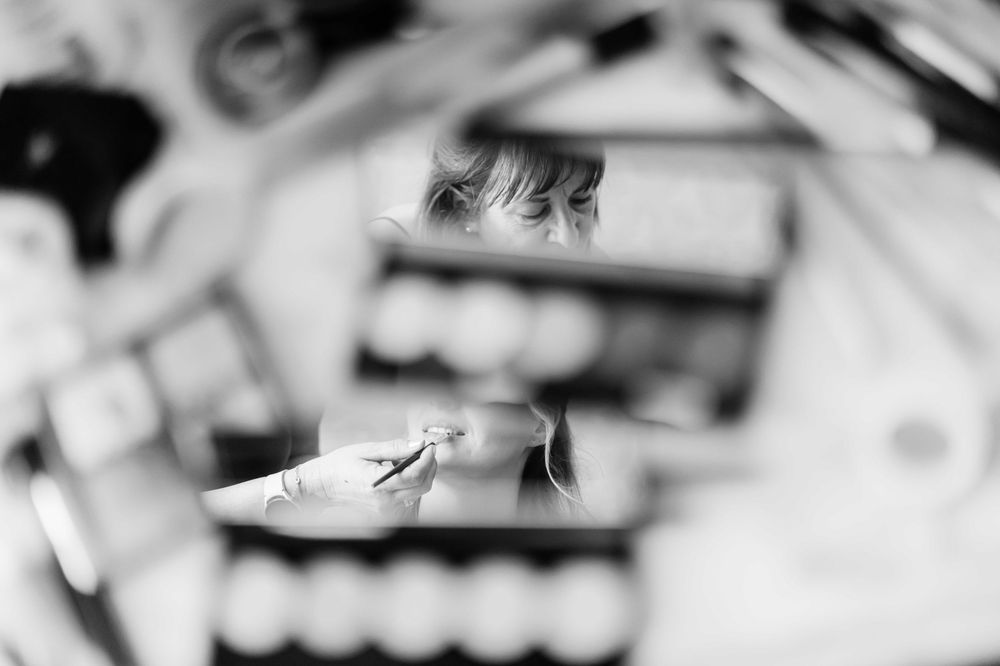 A blurred black and white close-up photograph of a sneaker or athletic shoe.