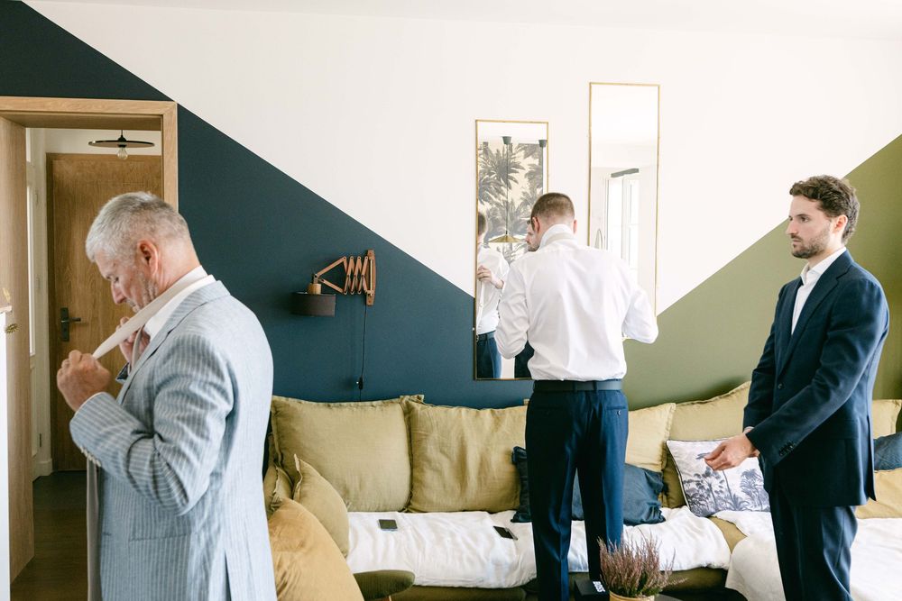 A series of business professionals in suits are shown reviewing documents in an office setting.