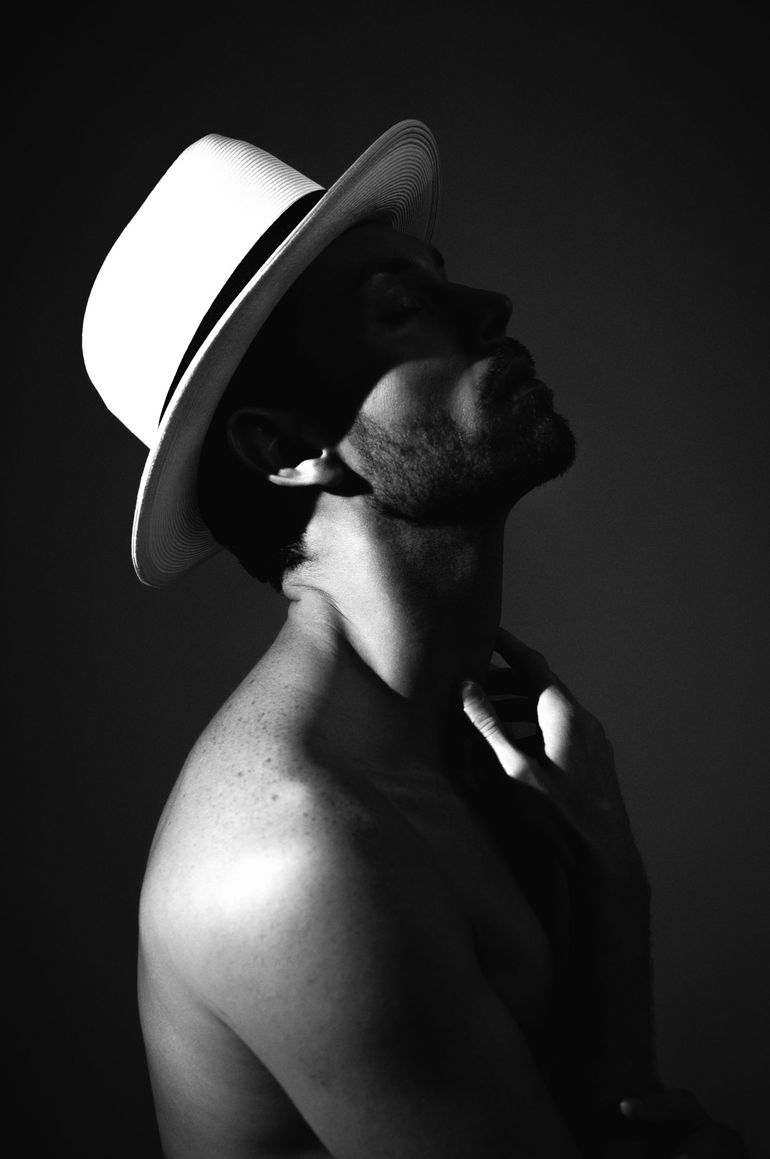 Black and white male self portrait with a fedora- creative male portrait posing. Carl James Photography in Salt Lake City Utah.
